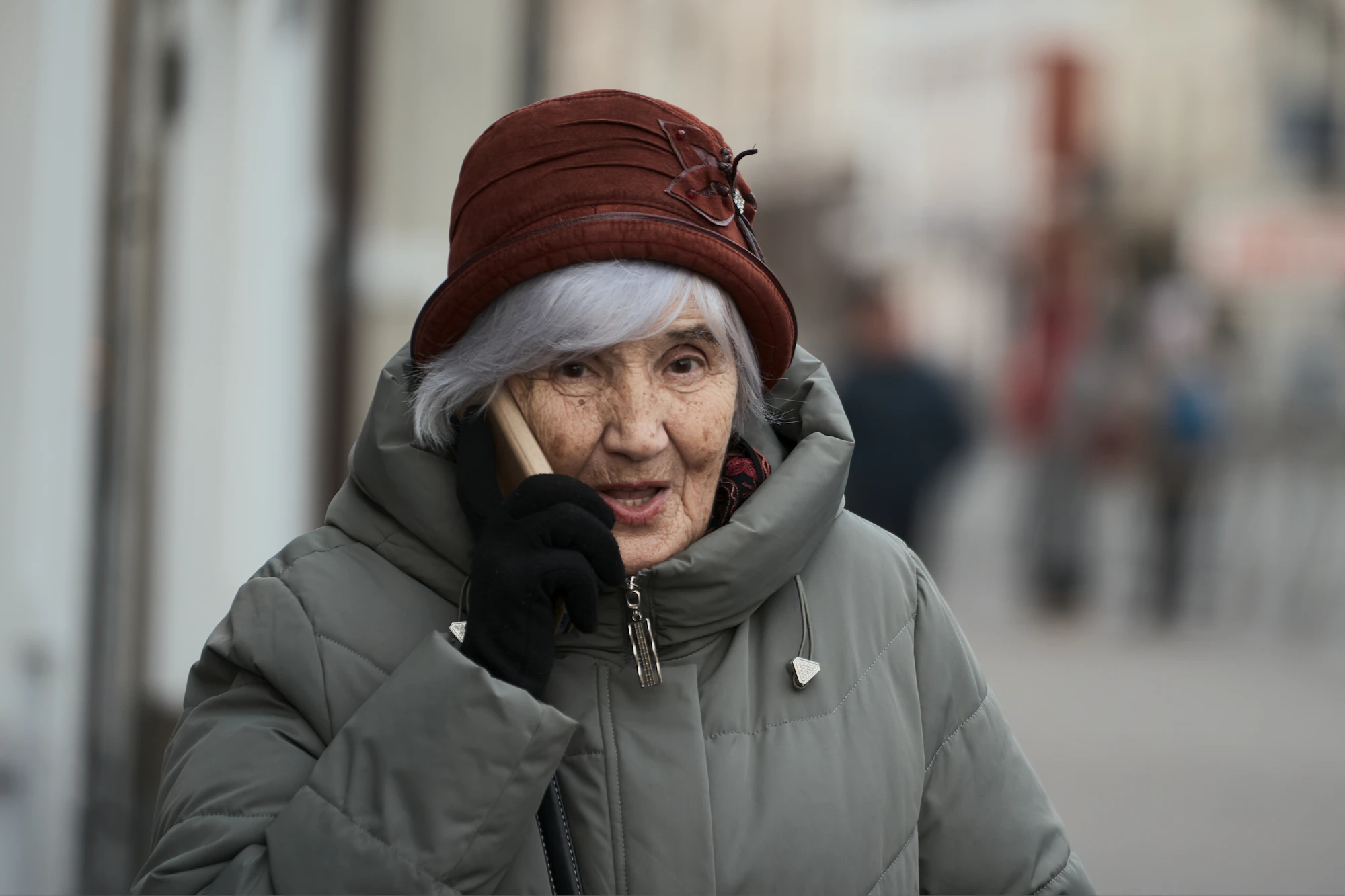 An older woman speaking naturally on a mobile phone